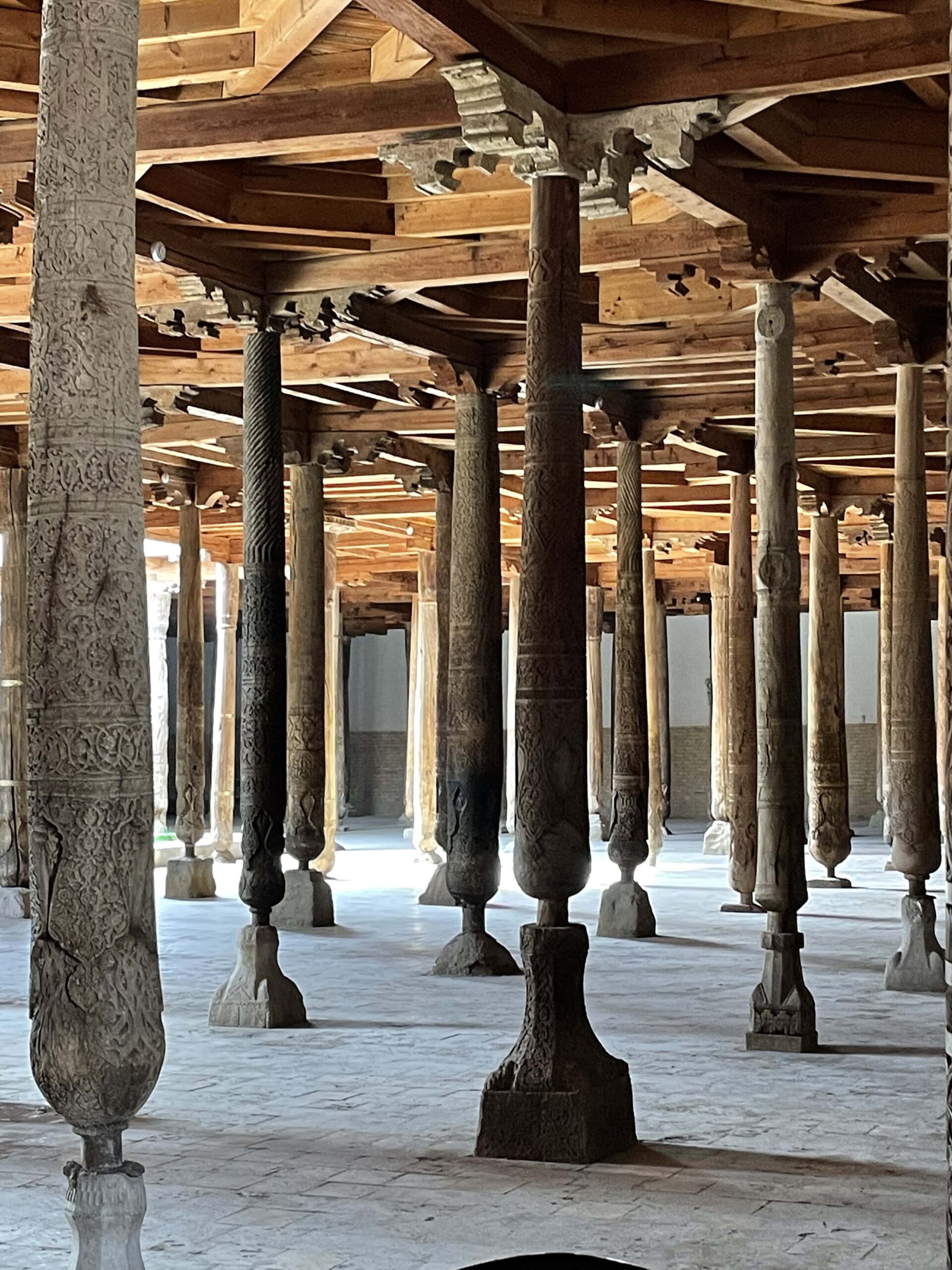 Ancient wooden Friday mosque or Juma mosque with over 200 carved wooden columns; town of Khiva, Uzbekistan. 