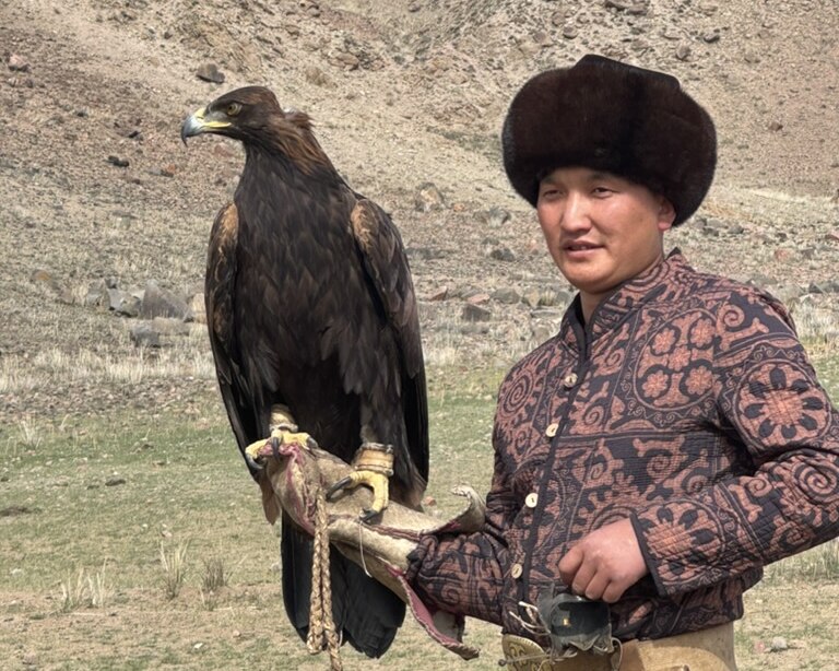 Eagle trainer holds female Golden Eagle.