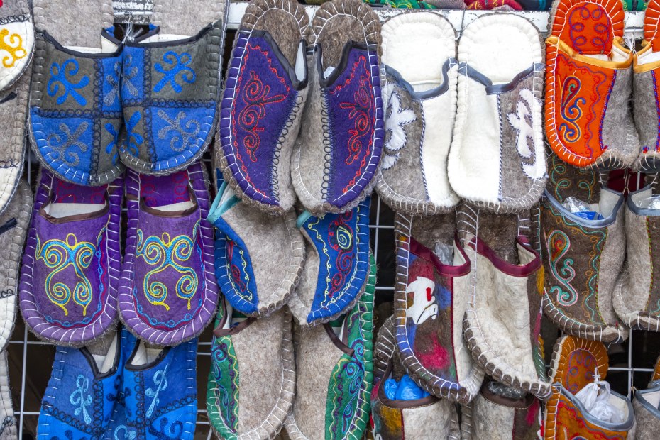 Shop display of felted slippers made of dyed wool, Kyrgyzstan.
