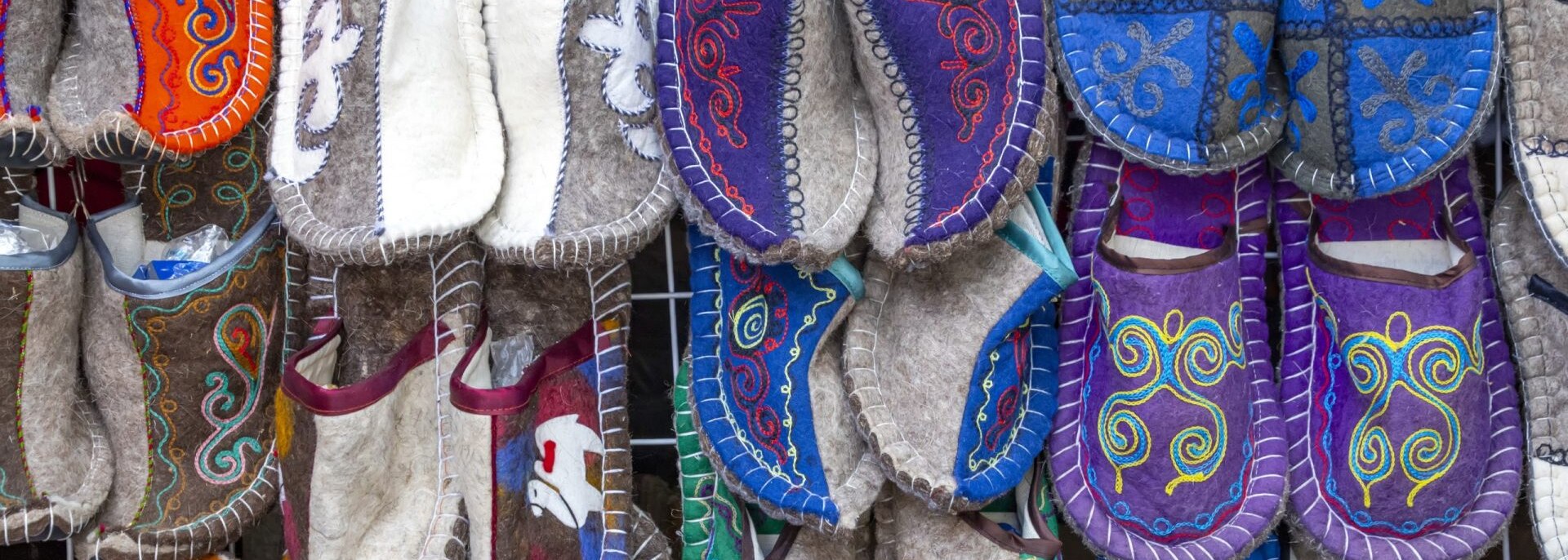 Shop display of felted slippers made of dyed wool, Kyrgyzstan.