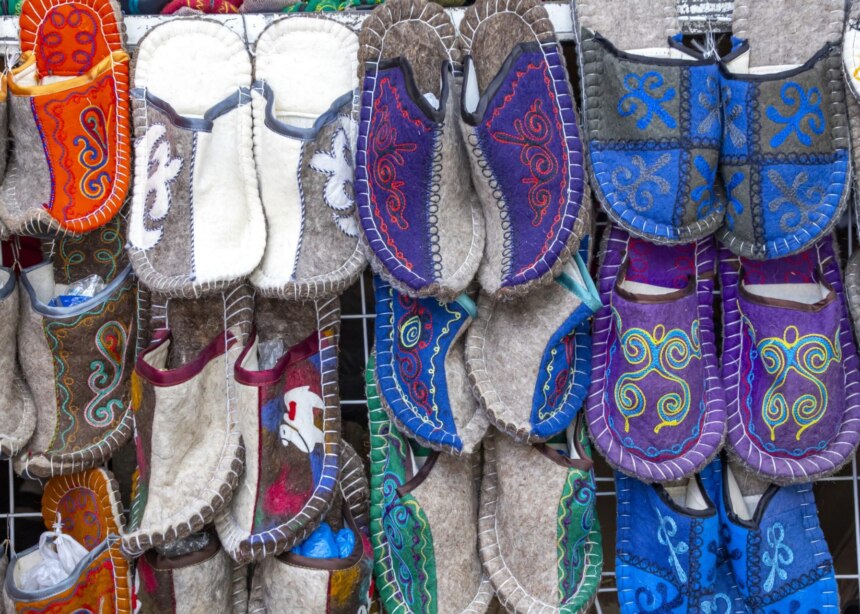 Shop display of felted slippers made of dyed wool, Kyrgyzstan.