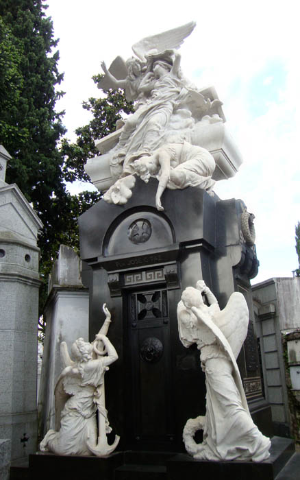 Marble angle sculptures on tomb in Recoleta Cemetary.; Buenos Aires.