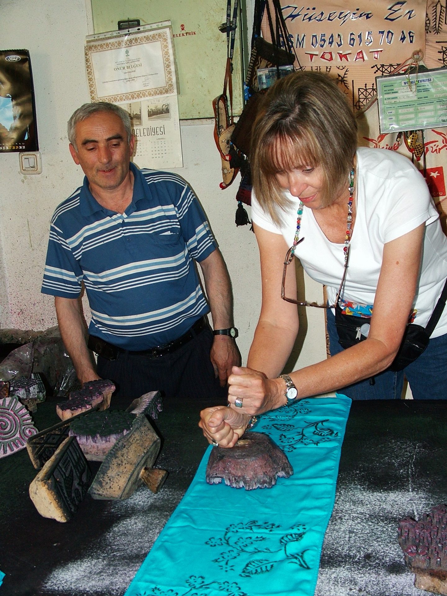 Carol pounds the printing block!