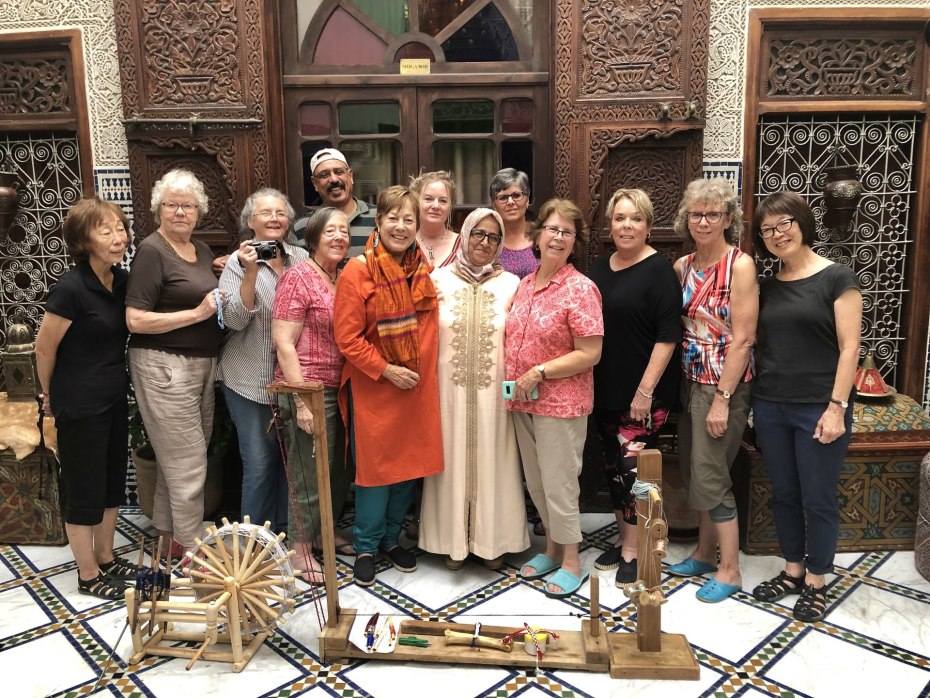 Group shares a laugh with Bouchra, friend who came to the hotel to show us how she makes sfifa or djellaba trim.