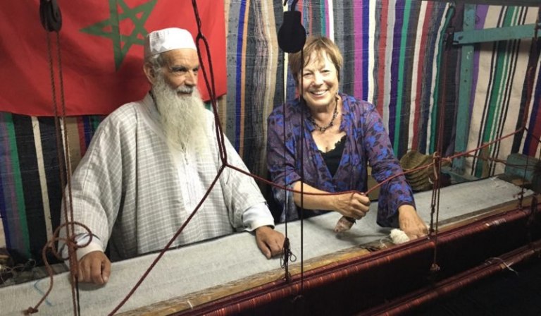 Traditional Muslim weaver with Cynthia, tour leader.