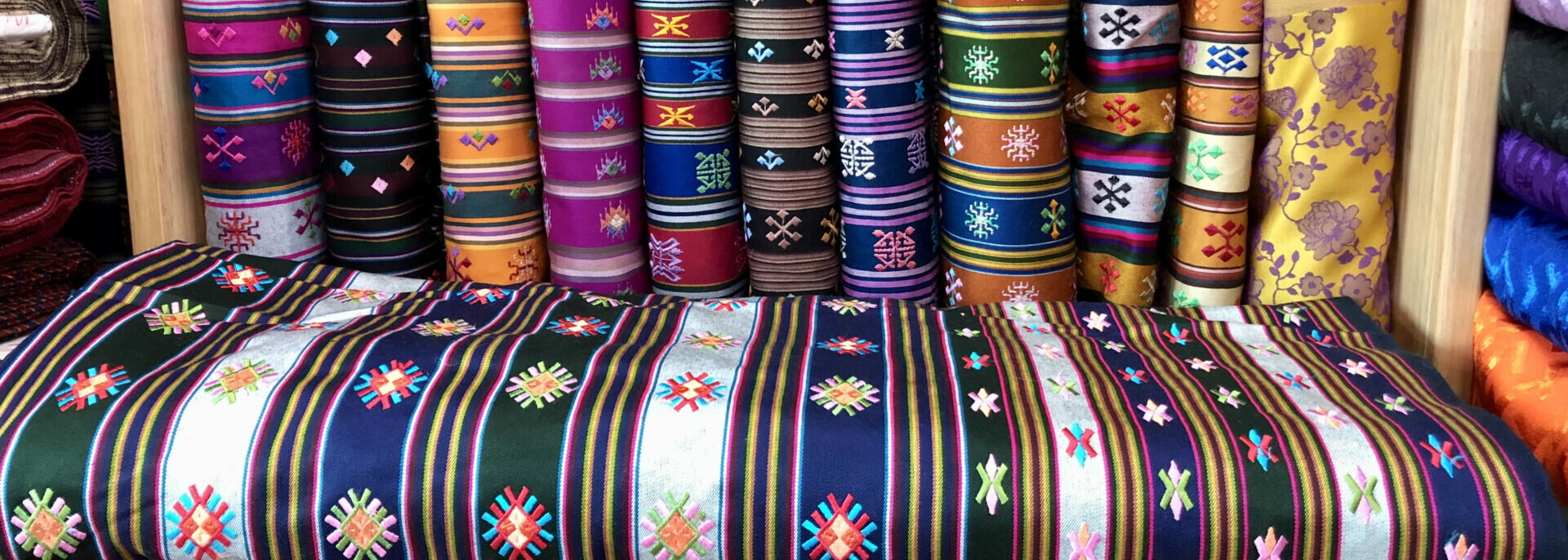 Factory-woven kira dress cloth with typical motifs.