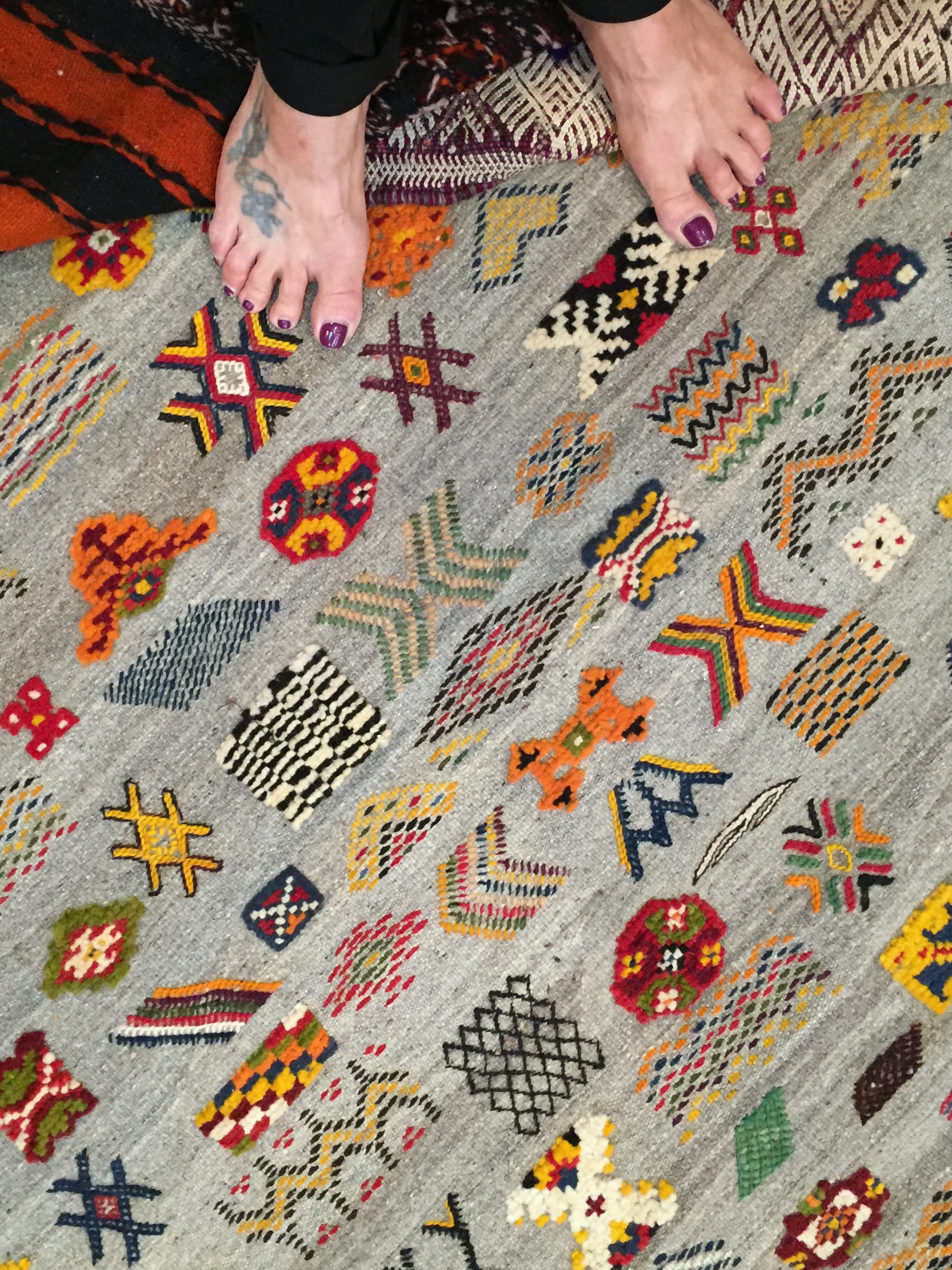A colorful wool Berber textile, a rug with a variety of motifs and weaving techniques.
