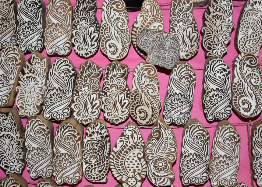 A group of small, hand-carved wood blocks for printing on fabric.