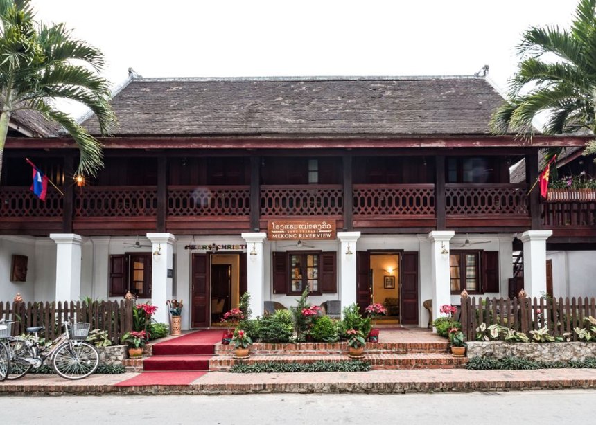 Wooden colonial style building of the  lovely Mekong Riverside hotel in Luang Prabang, Laos