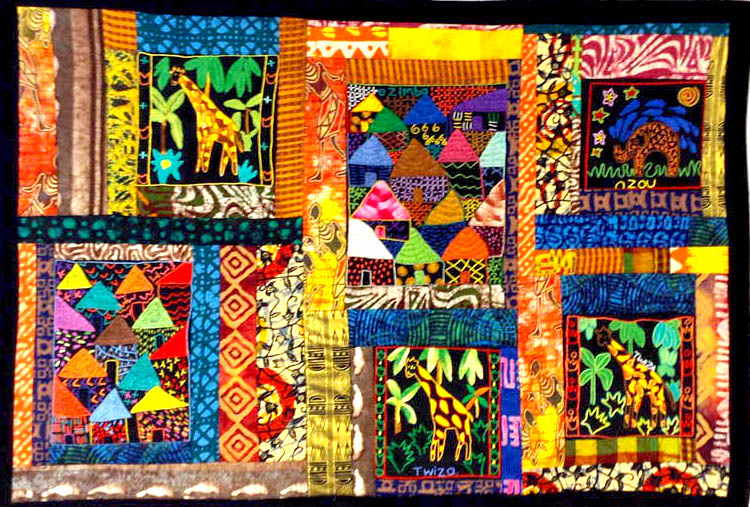 Patchwork quilt by Melanie Grishman, with African fabrics and images.