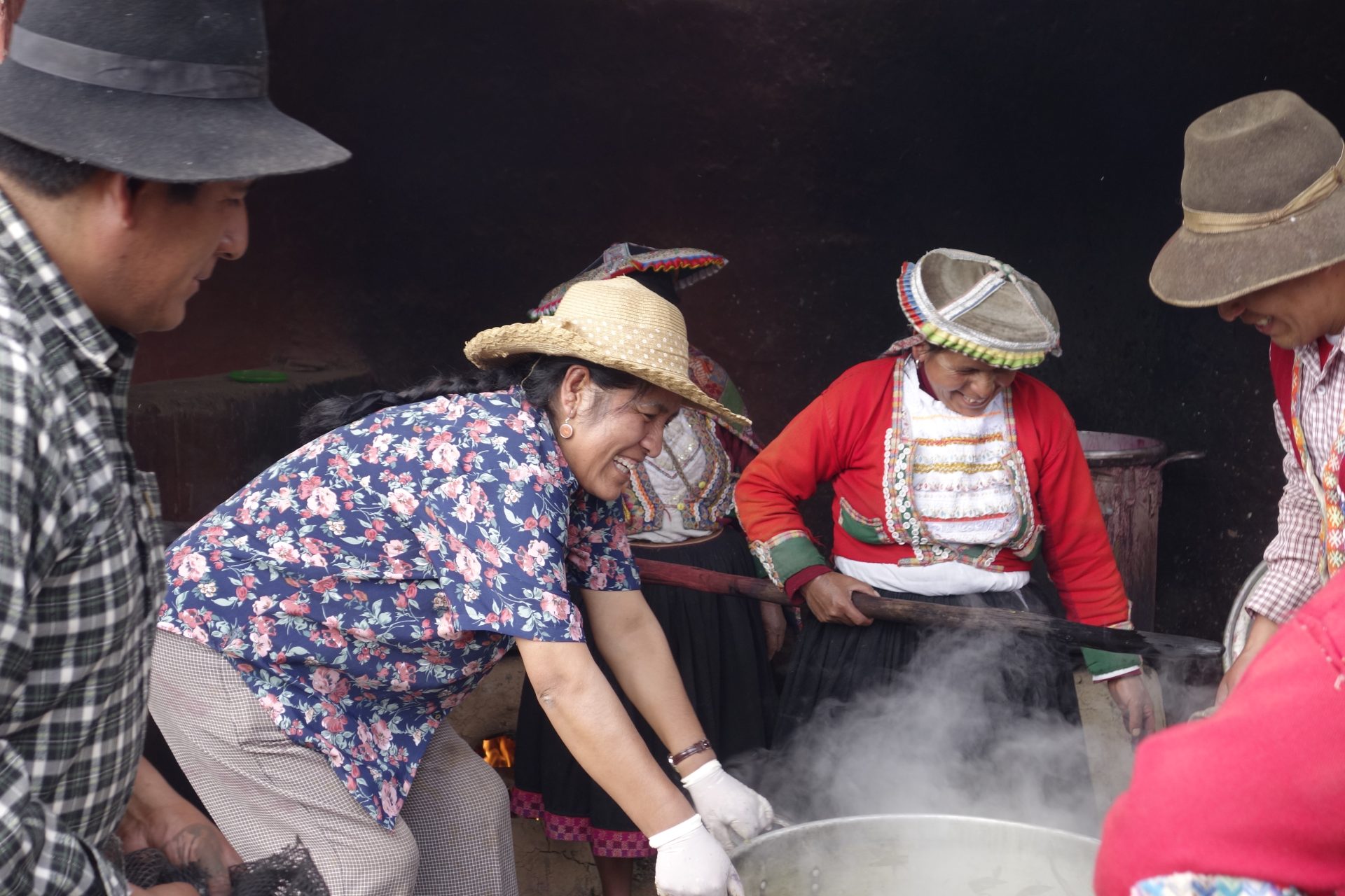 Nilda holds steaming dye pot Cuzco Peru
