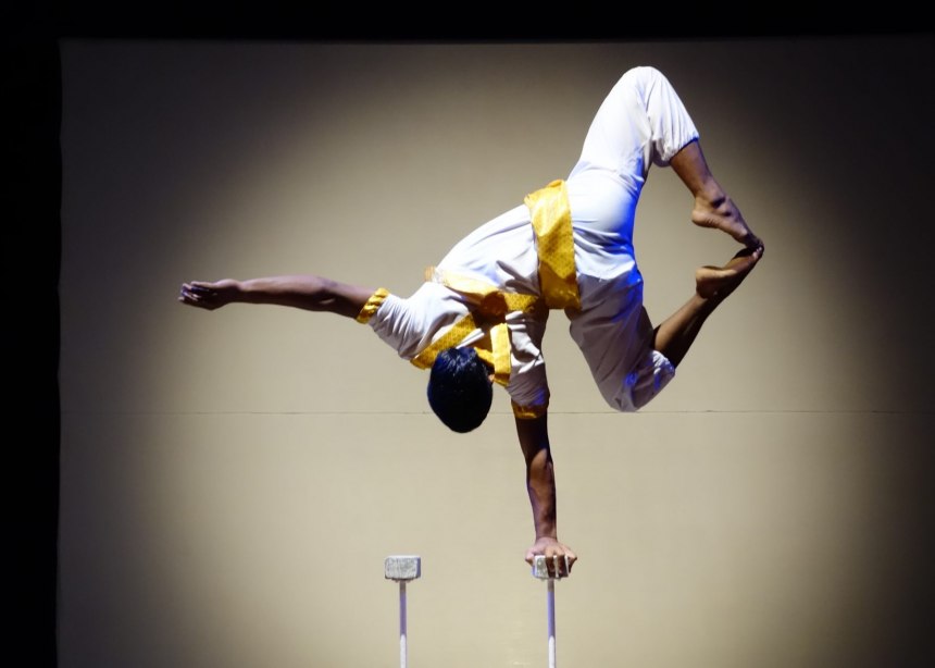 Young acrobat balances on one hand during the Phare Circus in Siem Reap.