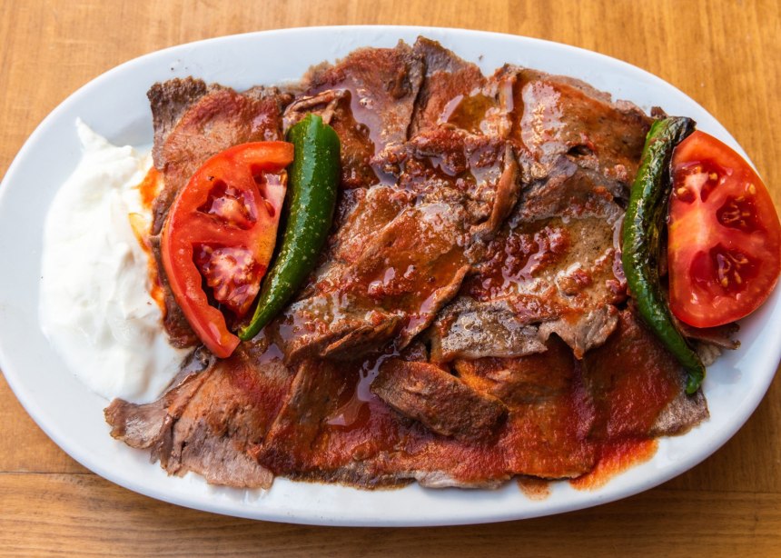 Dish of sliced beef with tomato sauce called Iskender Doner; Bursa Turkey,