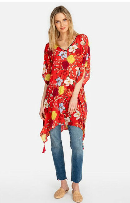 Blonde woman in orange flowered long blouse; idea for travel clothing.