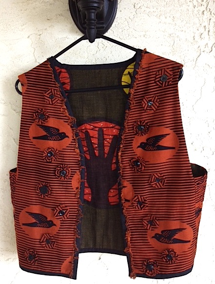 Patchwork vest of commercially printed fabrics from Ghana; by Brigit Pitcairn.